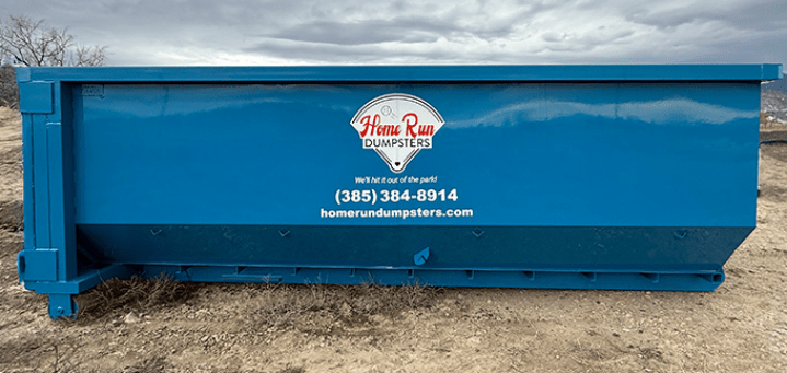Front view of a Home Run Dumpsters blue roll-off dumpster